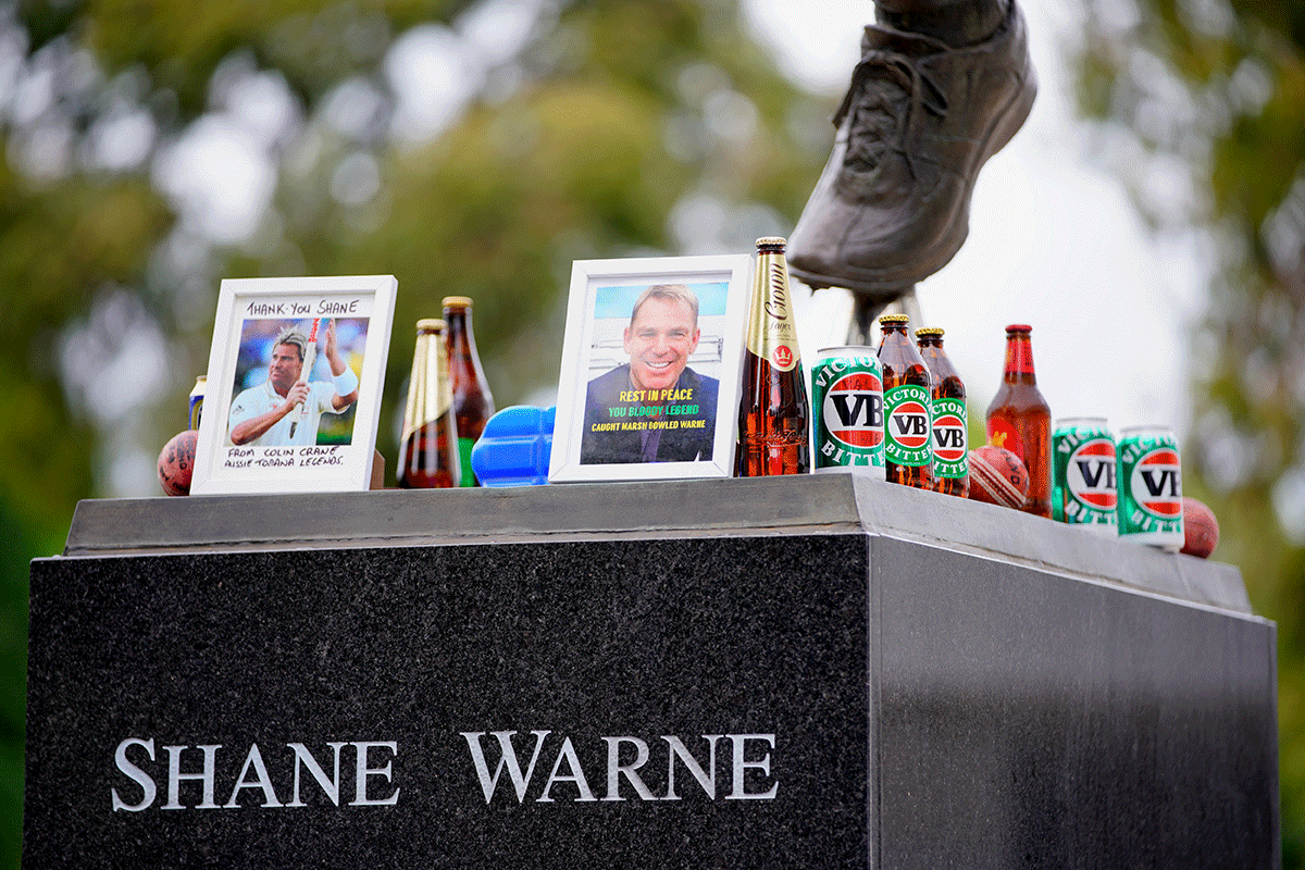 Tributes lie on the statue of the late cricketer Shane Warne outside the Melbourne Cricket Ground (MCG) in Melbourne, Australia on March 5, 2022.