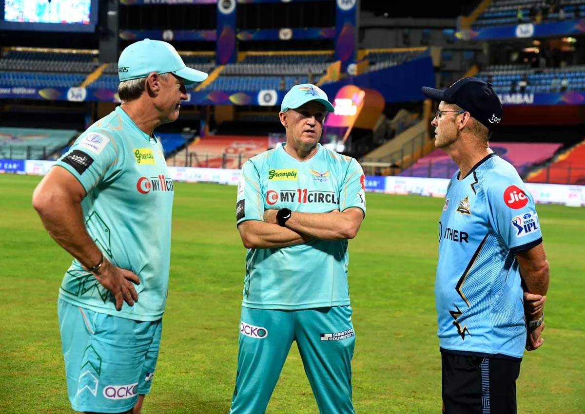 Australian Andy Bichel, LSG's bowling coach, left, LSG Coach Zimbabwean Andy Flower, centre, and GT Batting Coach South African Gary Kirsten have a post match chat.