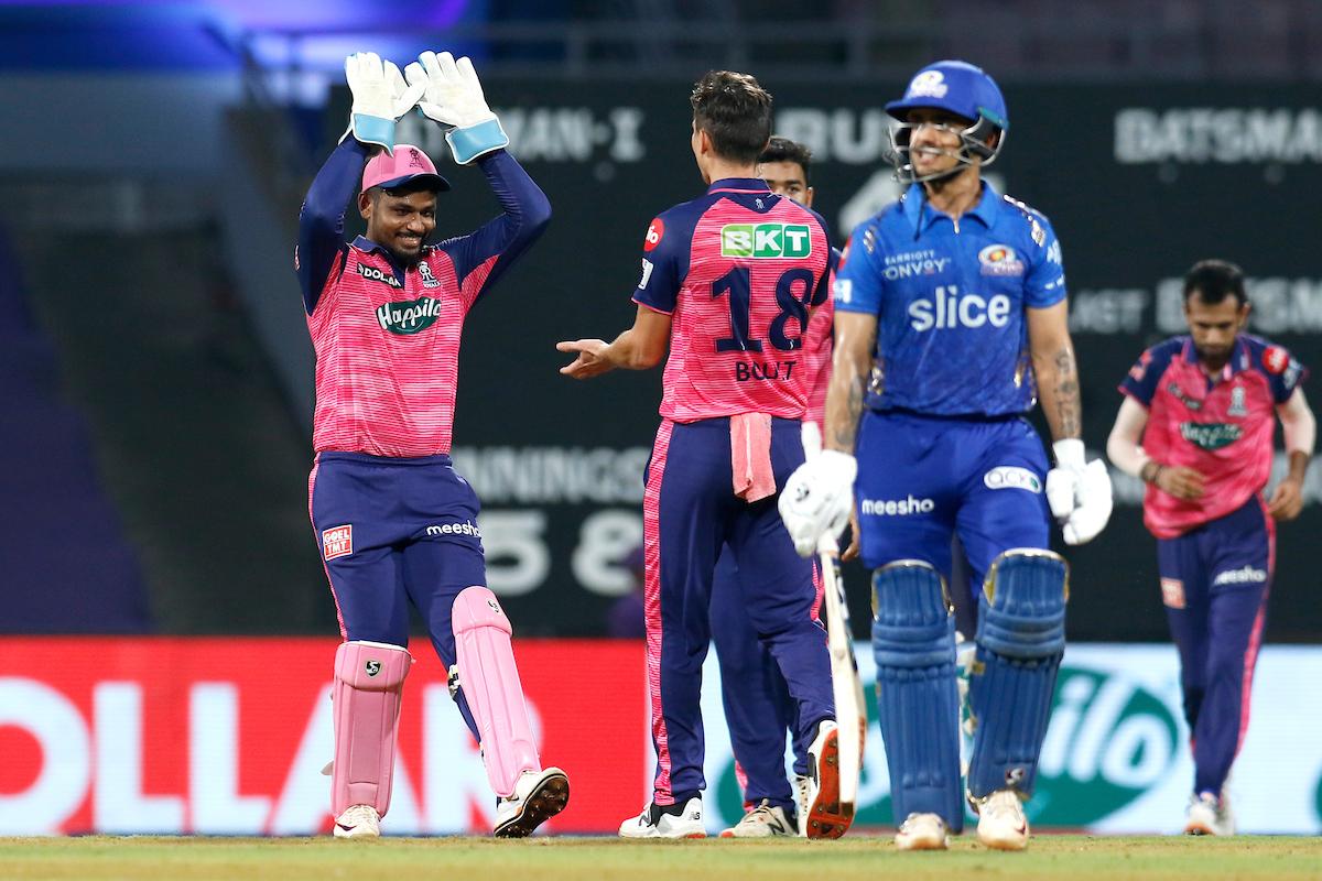 Rajasthan Royals pacer Trent Boult celebrates with skipper Sanju Samson after dismissing Mumbai Indians opener Ishan Kishan during the IPL match at the D Y Patil Stadium in Navi Mumbai on Saturday.