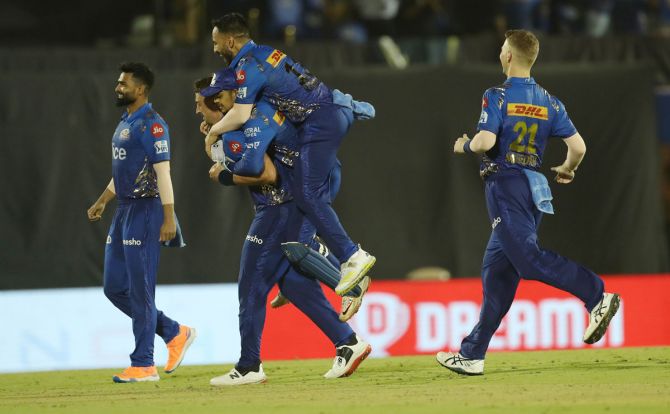 Mumbai Indians' celebrate winning the match against Gujarat Titans