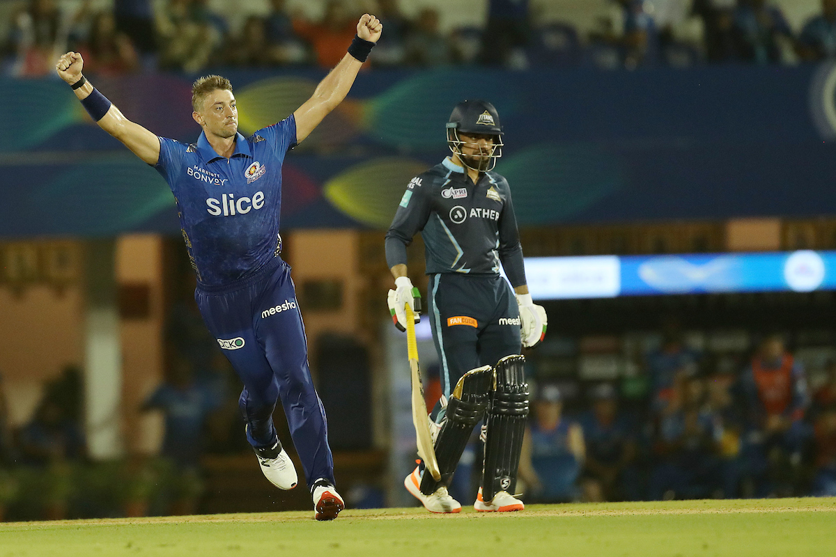Mumbai Indians pacer Daniel Sams celebrates after clinching a narrow victory over Gujarat Titans in the IPL match at the Brabourne Stadium, in Mumbai, on Friday.