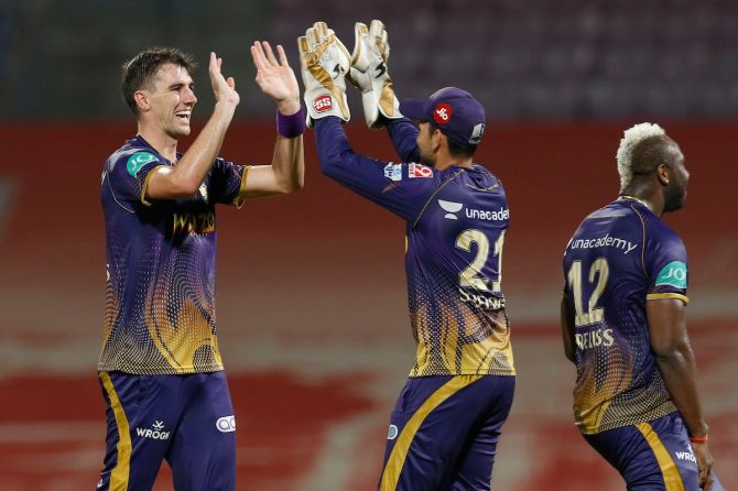 KKR's Pat Cummins and celebrates with keeper Sheldon Jackson on getting the wicket of Mumbai Indians' Daniel Sams. Cummins finished with figures of 3 for 22 off his 4 overs