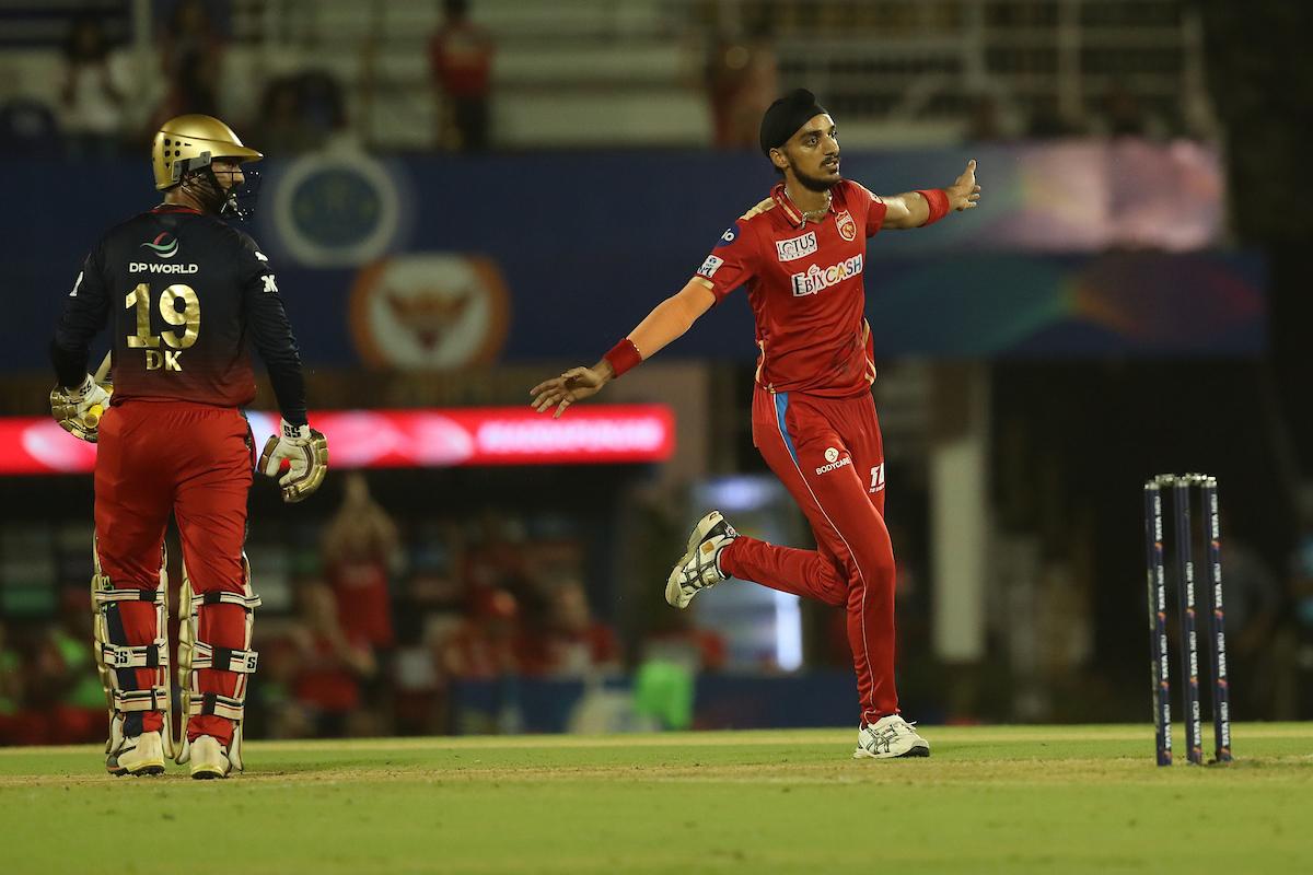 Punjab Kings pacer Arshdeep Singh celebrates dismissing Royal Challengers Bangalore's Dinesh Karthik during the IPL match at the Brabourne Stadium in Mumbai on Friday.