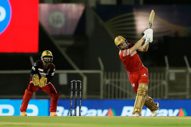 Punjab Kings opener Jonny Bairstow steps out to send the ball over the fence during his blazing 66 off just 29 balls, which included four boundaries and seven sixes, in the IPL match against Royal Challengers Bangalore in Mumbai on Friday.