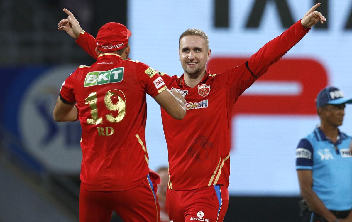 Liam Livingstone celebrates the wicket of David Warner