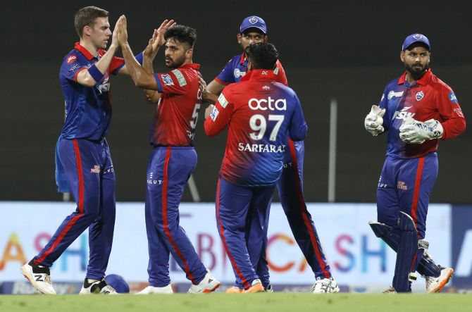 Delhi Capitals batters celebrate the wicket of Shikhar Dhawan