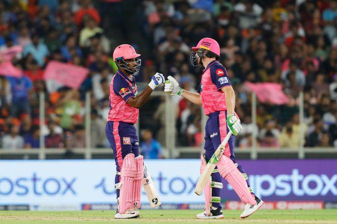 Rajasthan Royals' Sanju Samson and Jos Buttler celebrate a six against Royal Challengers Bangalore during Qualifier 2 of IPL 2022, at the Narendra Modi Stadium, in Ahmedabad, on Friday.