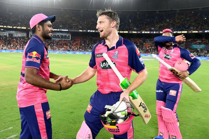 Jos Buttler is congratulated by skipper Sanju Samson after steering Rajasthan Royals past Royal Challengers Bangalore in Qualifier 2 of IPL 2022 in Ahmedabad on Friday.