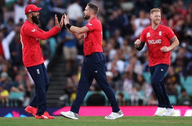 England pacer Chris Woakes celebrates dismissing Kusal Mendis.