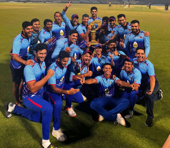 Mumbai's players celebrate with the trophy after winning the Mushtaq Ali Trophy final