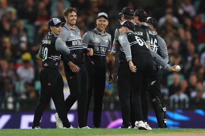 New Zealand pacer Tim Southee celebrates with teammates after dismissing David Warner in the T20 World Cup match at Sydney Cricket Ground on October 22, 2022. New Zealand's thrashing of Australia in their opening game ultimately proved decisive.