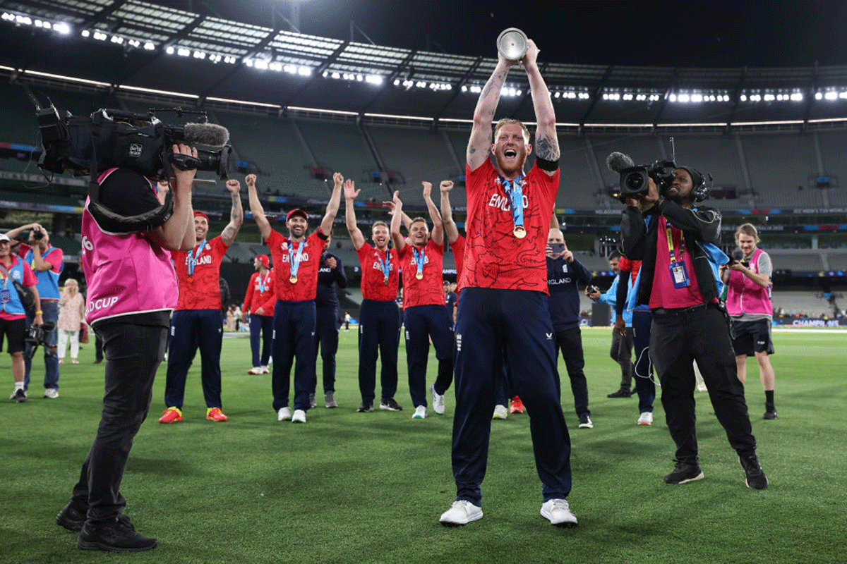 England's Ben Stokes celebrates victory with the T20 World Cup trophy on Sunday