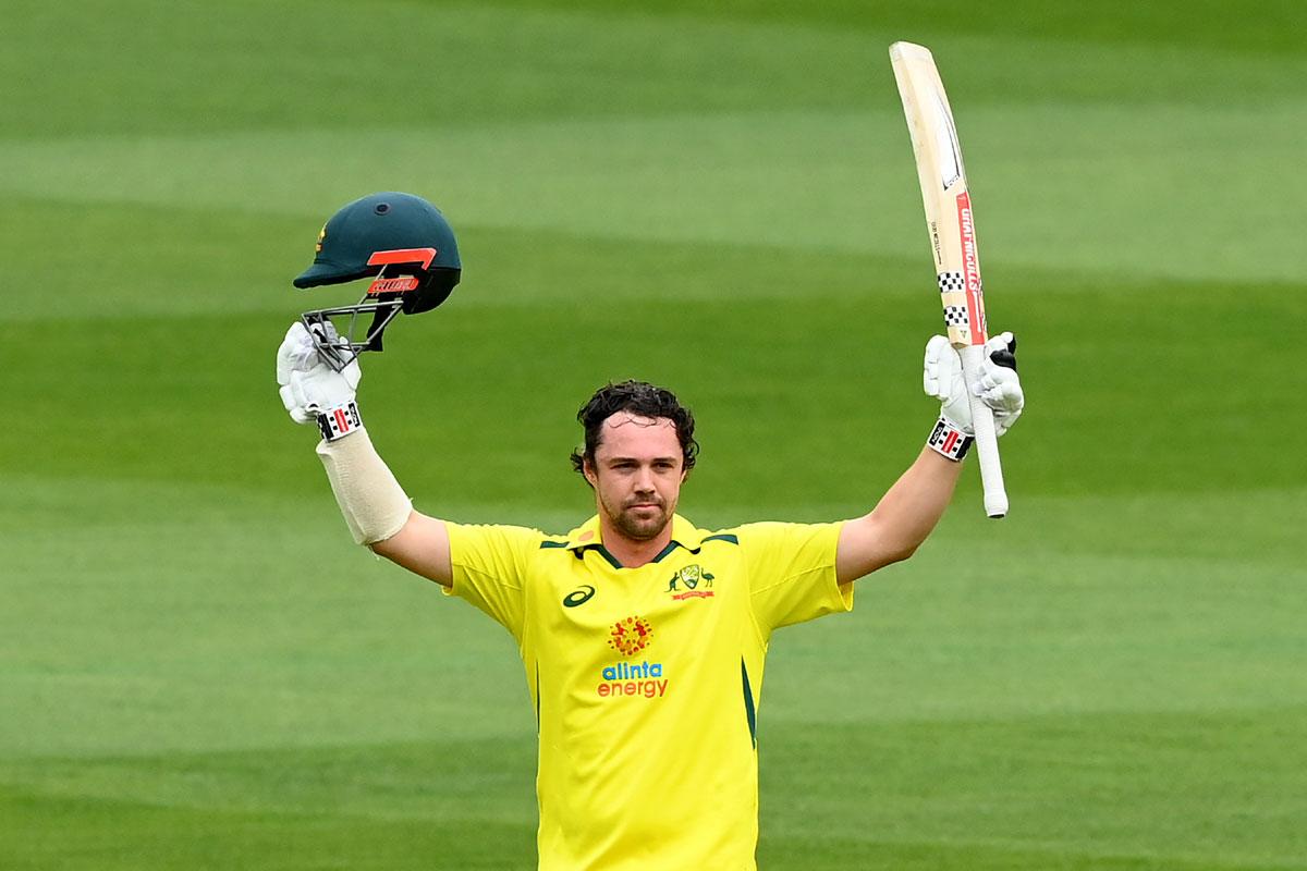 Travis Head celebrates completing his hundred.