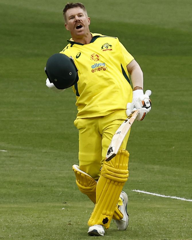 David Warner celebrates after scoring a hundred during the third One-Day International against England, at Melbourne Cricket Ground, on Tuesday.