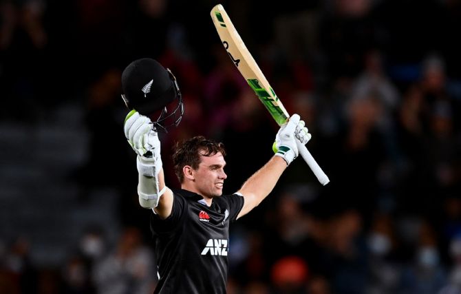 New Zealand's Tom Latham celebrates scoring a century during the first One-Day International against India, at Eden Park in Auckland, on Friday.