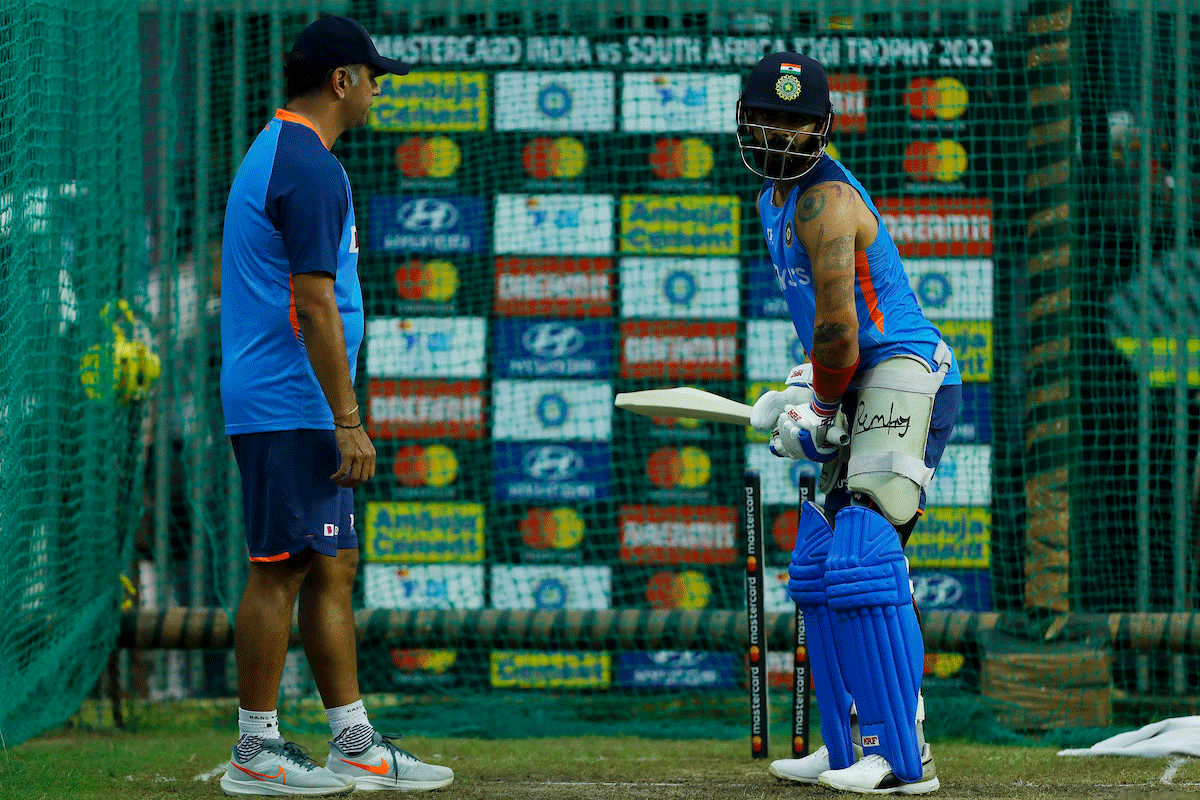 Virat Kohli bats in the nets as Head Coach Rahul Dravid overlooks proceedings at practice in Guwahati on Saturday