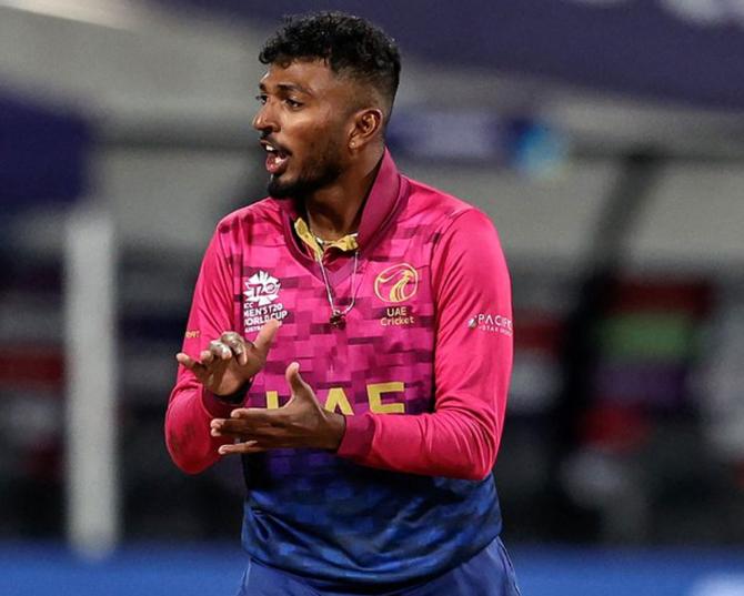  United Arab Emirates spinner Karthik Meiyappan celebrates after completing his hat-trick 