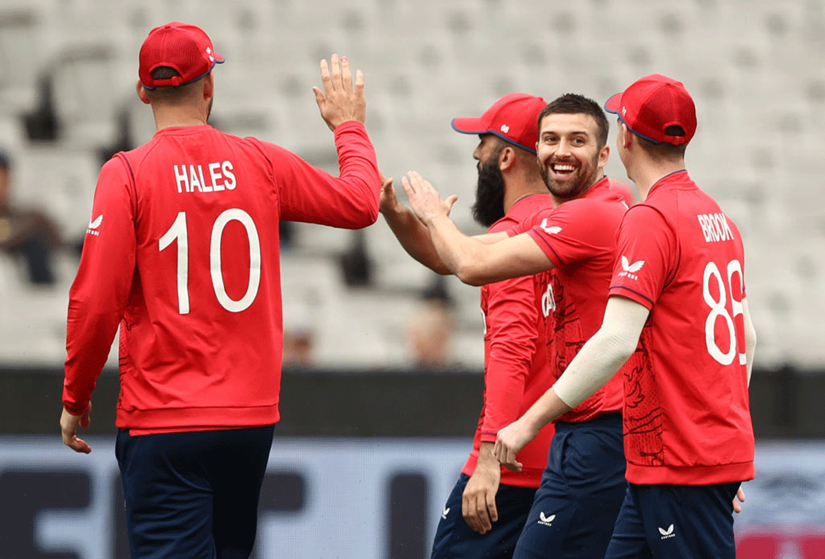 England's Mark Wood celebrates taking the wicket of Ireland's Paul Stirling