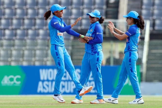 Indian skipper Harmanpreet Kaur with teammates Sneh Rana and Renuka Singh celebrate the dismissal of Sri Lankan skipper Chamari Athapaththu