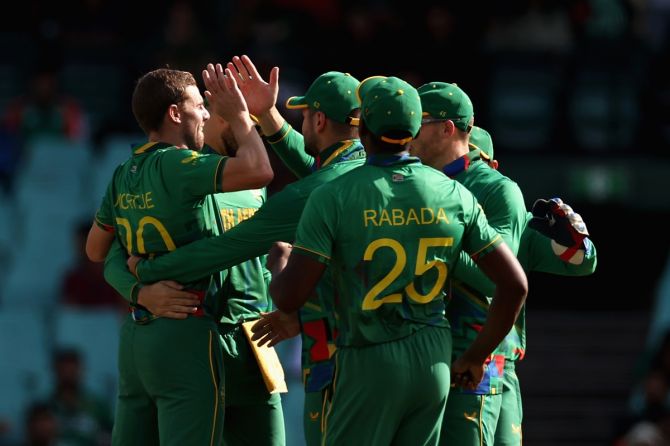 Anrich Nortje is congratulated by teammates after dismissing Bangladesh opener Najmul Hossain Shanto.