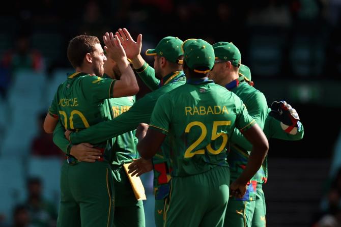 Anrich Nortje is congratulated by teammates after dismissing Bangladesh opener Najmul Hossain Shanto.