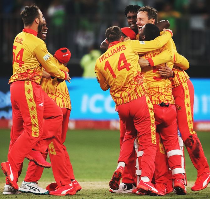 Zimbabwe's players celebrate after clinching a memorable victory of Pakistan