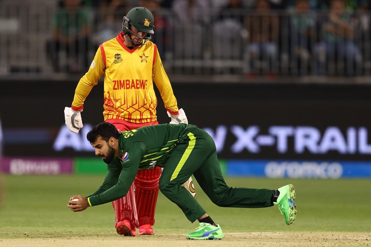 Shadab Khan takes the catch off his own bowling to dismiss Milton Shumba.