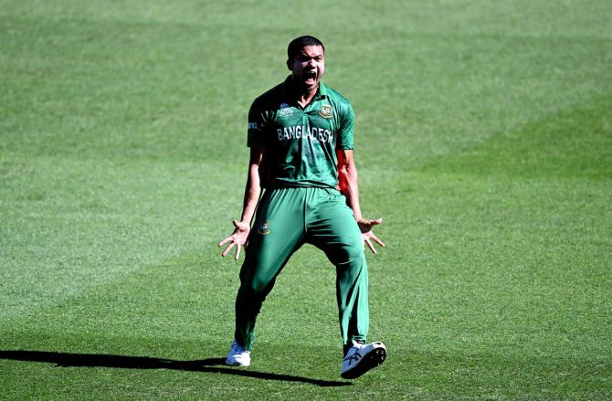 Taskin Ahmed celebrates taking the wicket of Craig Ervine