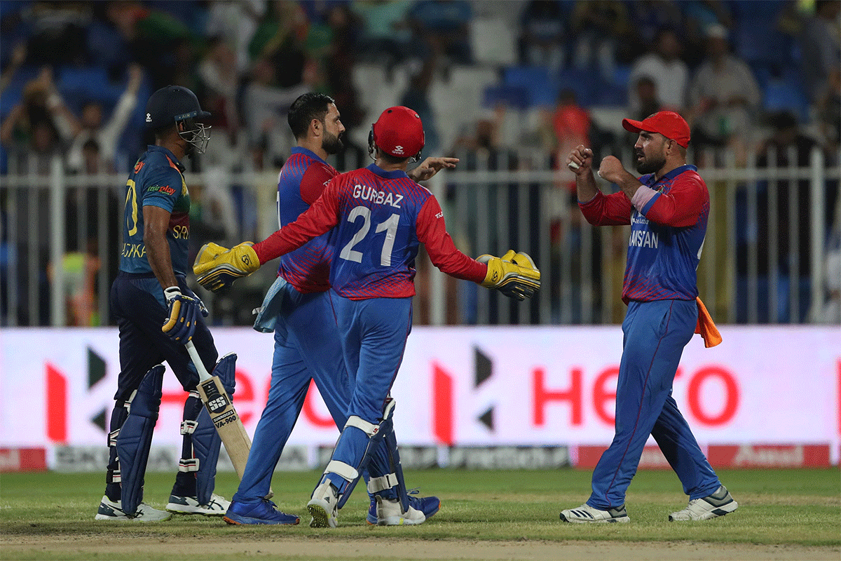 Afghanistan's Mohammad Nabi celebrates the wicket of Charith Asalanka