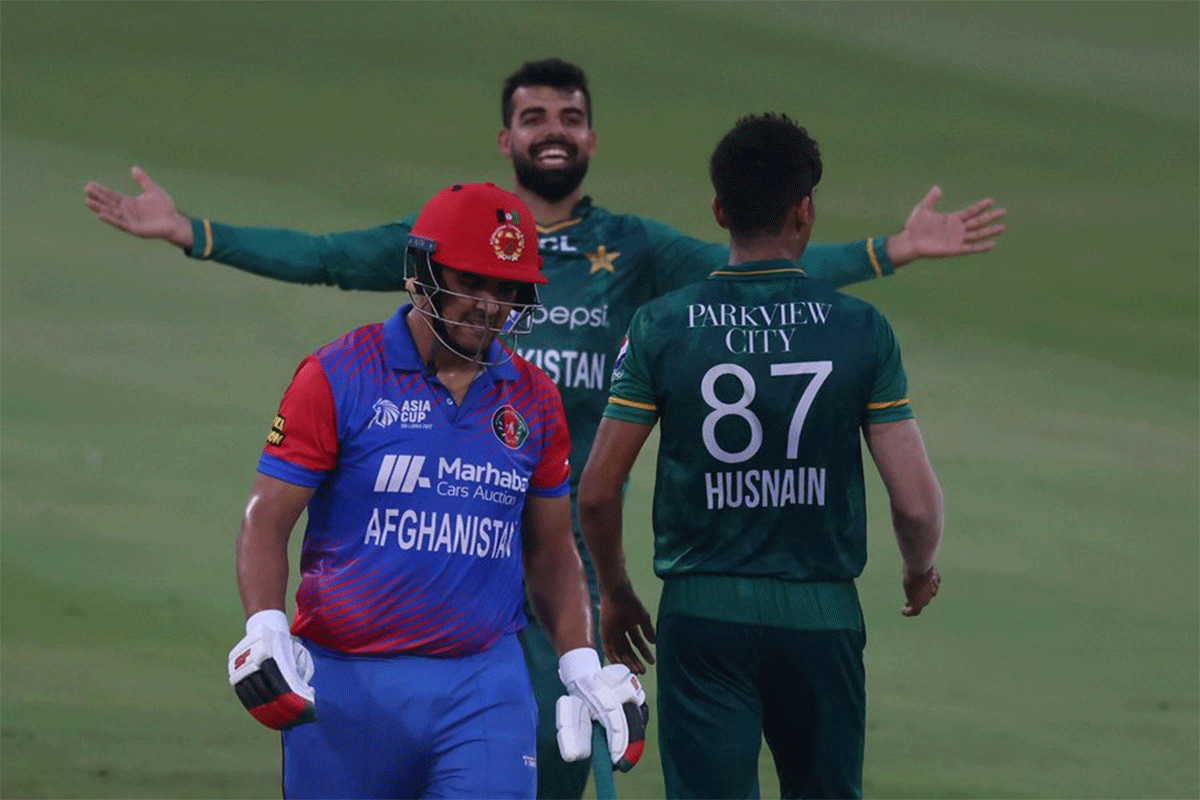 Pakistan's Shadab Khan celebrates after taking the wicket of Afghanistan's Najibullah Zadran.