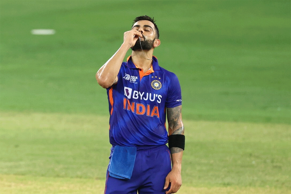 Virat Kohli kisses his ring after completing his 71st international ton in the Asia Cup match against Afghanistan on Thursday