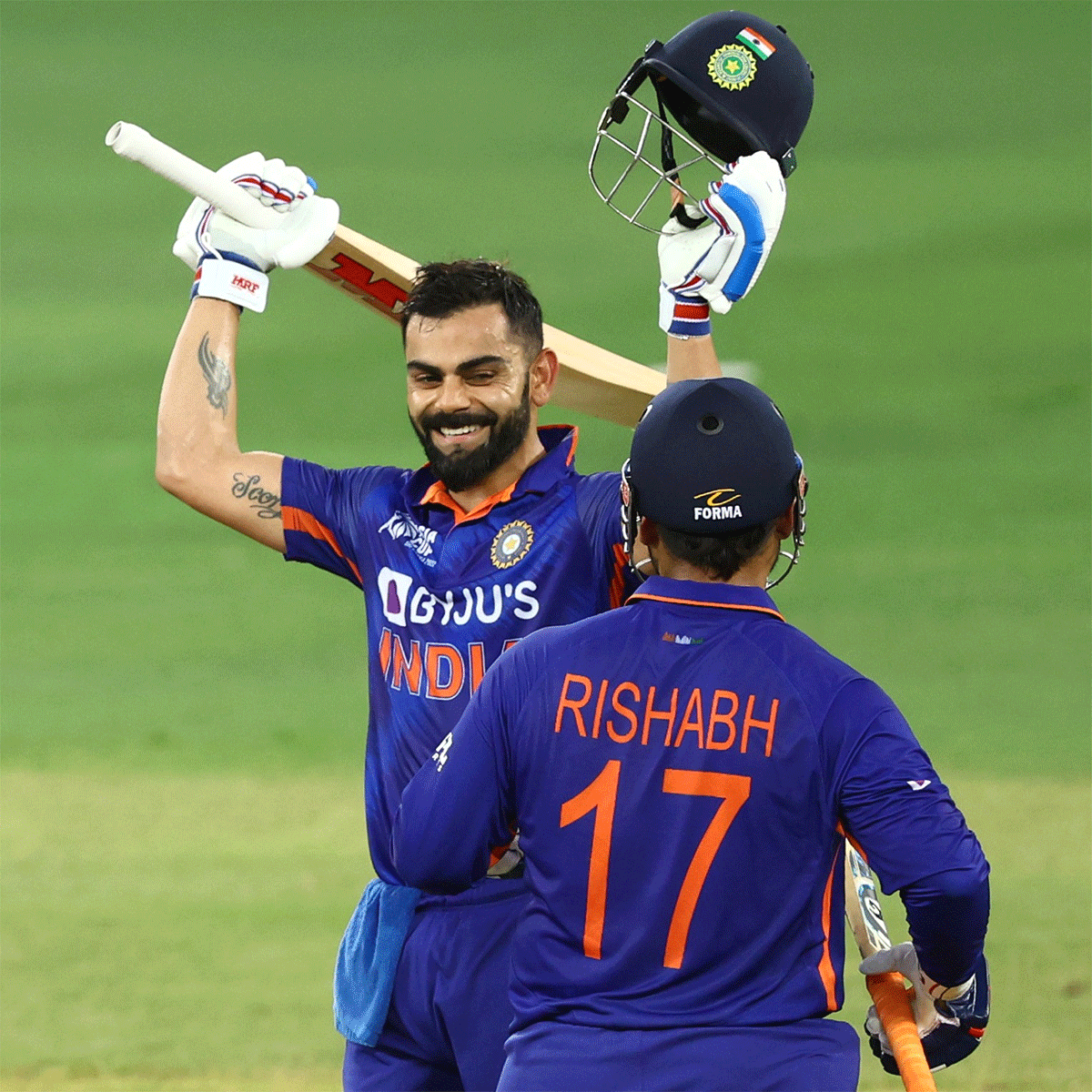 Virat Kohli celebrates on completing his maiden T20I century on Thursday