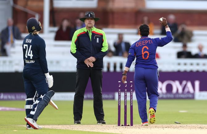  England's top-scorer Charlie Dean reacts after being run-out by Deepti Sharma.