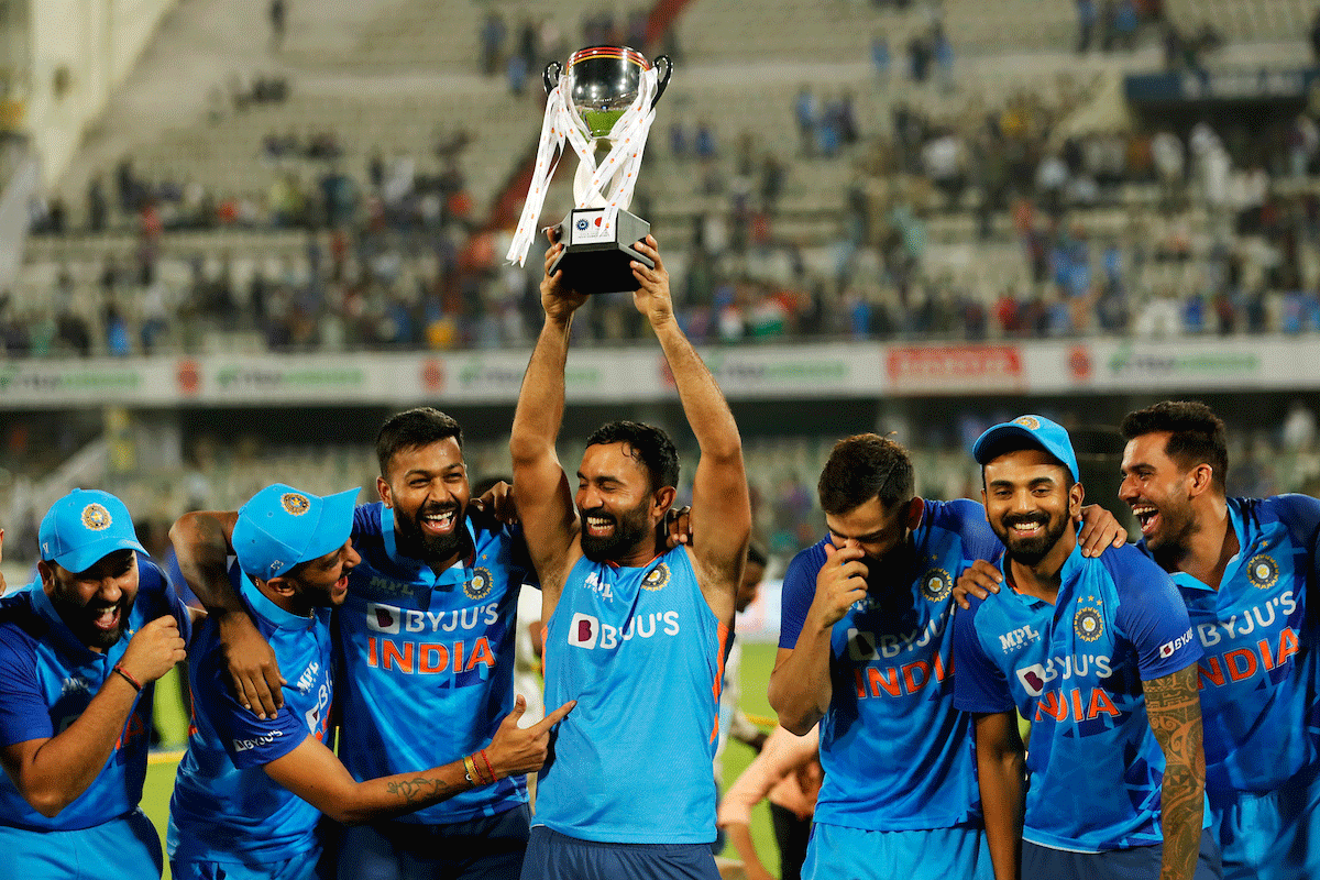 The Indian cricket team celebrate with the trophy after beating Australia in the 3rd T20I to win the series 2-1 in Hyderabad on Sunday