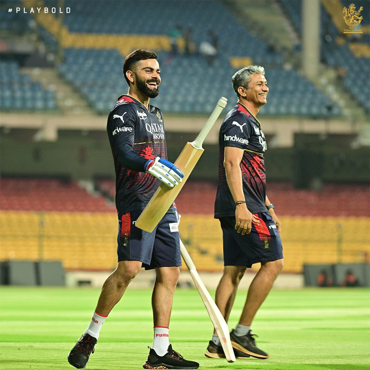 RCB's Virat Kohli and head coach Sanjay Bangar share a laugh during practice