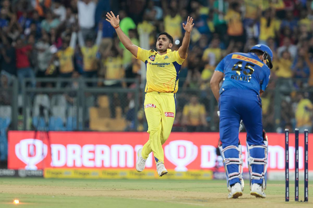 Tushar Deshpande celebrates the wicket of Rohit Sharma