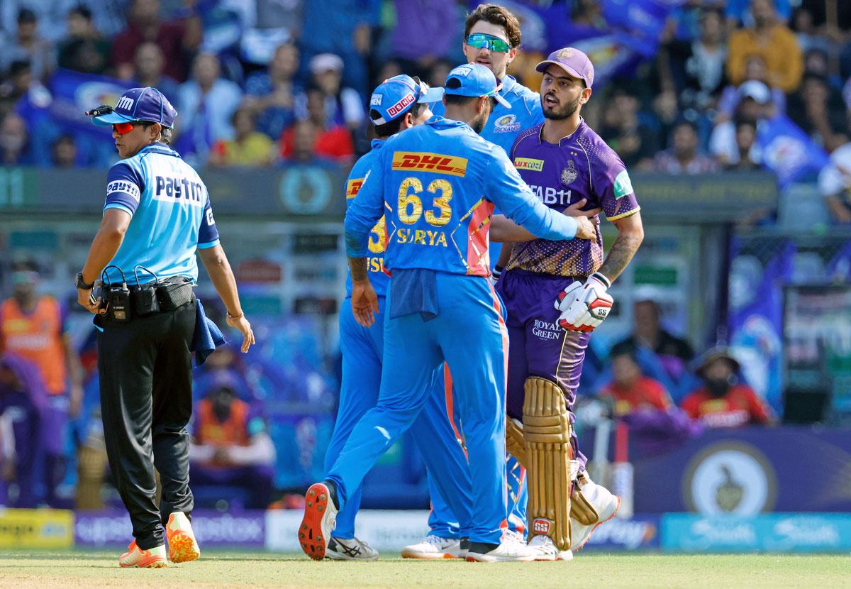 KKR's Nitish Rana is restrained by Mumbai Indians' Surya Kumar Yadav and Piyush Chawla as he exchanges words with Hrithik Shokeen