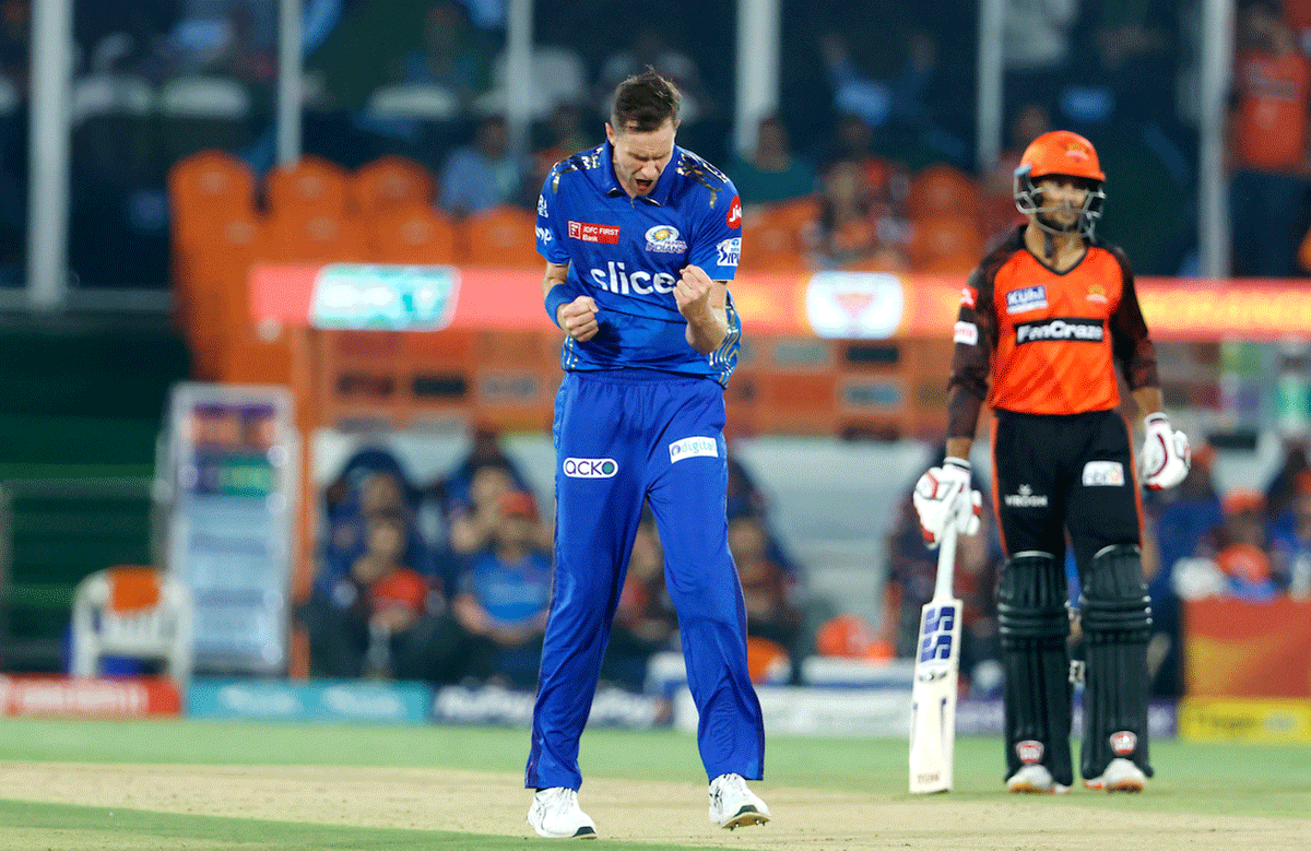 Jason Behrendorff  celebrates the wicket of Rahul Tripathi 