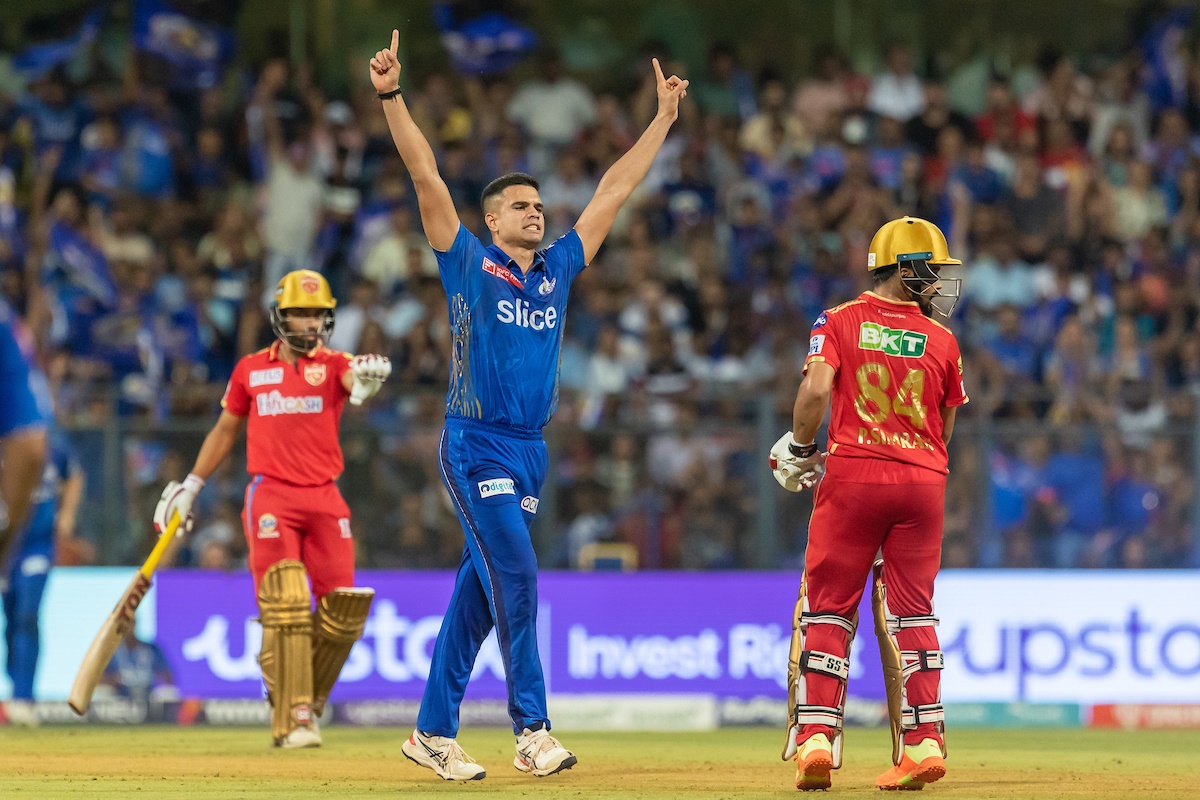 Arjun Tendulkar celebrates dismissing Punjab Kings opener Prabhsimran Singh early in the IPL match in Mumbai on Saturday. However, the Mumbai Indians pacer went for 31 runs in the 15th over of the Punjab innings. 