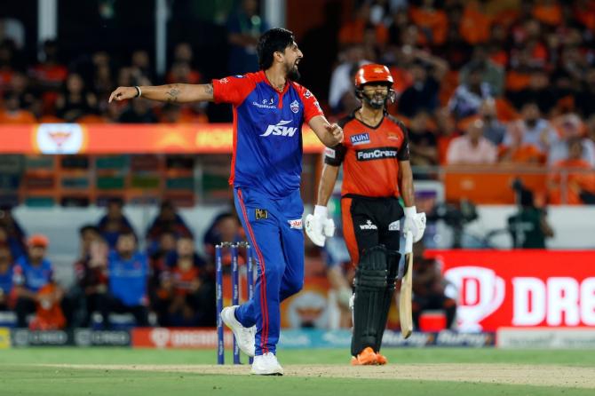 Ishant Sharma celebrates the wicket of Rahul Tripathi