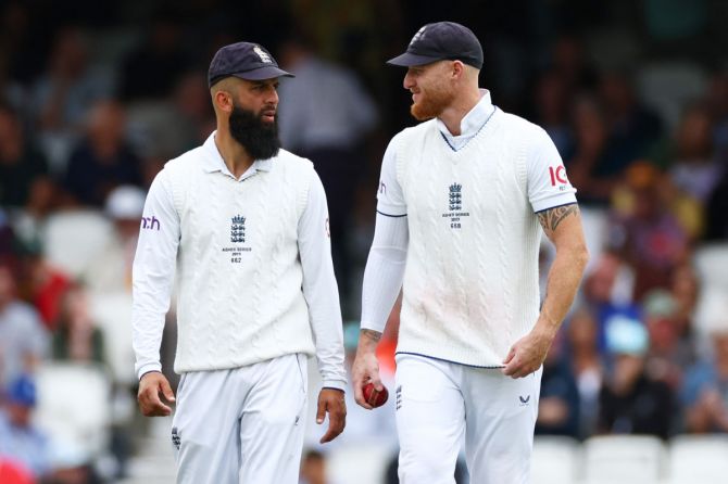 England's Ben Stokes and Moeen Ali speak during the fifth Ashes Test. Moeen moved up the order to bat at number three following an injury to Ollie Pope and despite suffering a groin injury, took three wickets on the final day at The Oval as England won the last Test by 49 runs