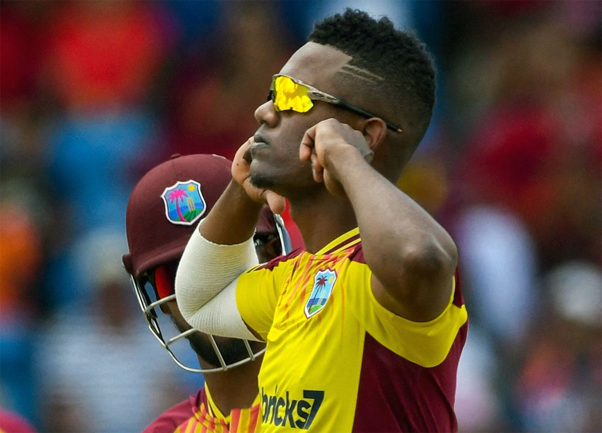 West Indies spinner Akeal Hosein celebrates a wicket. 