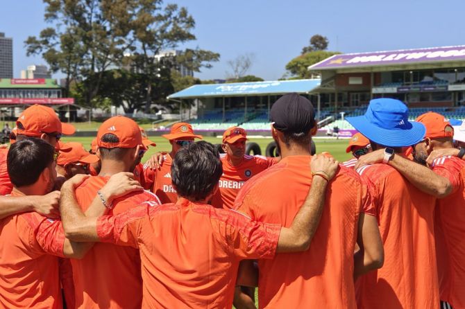 India's Head Coach Rahul Dravid speaks to his players in a huddle ahead of the T20I in Durban