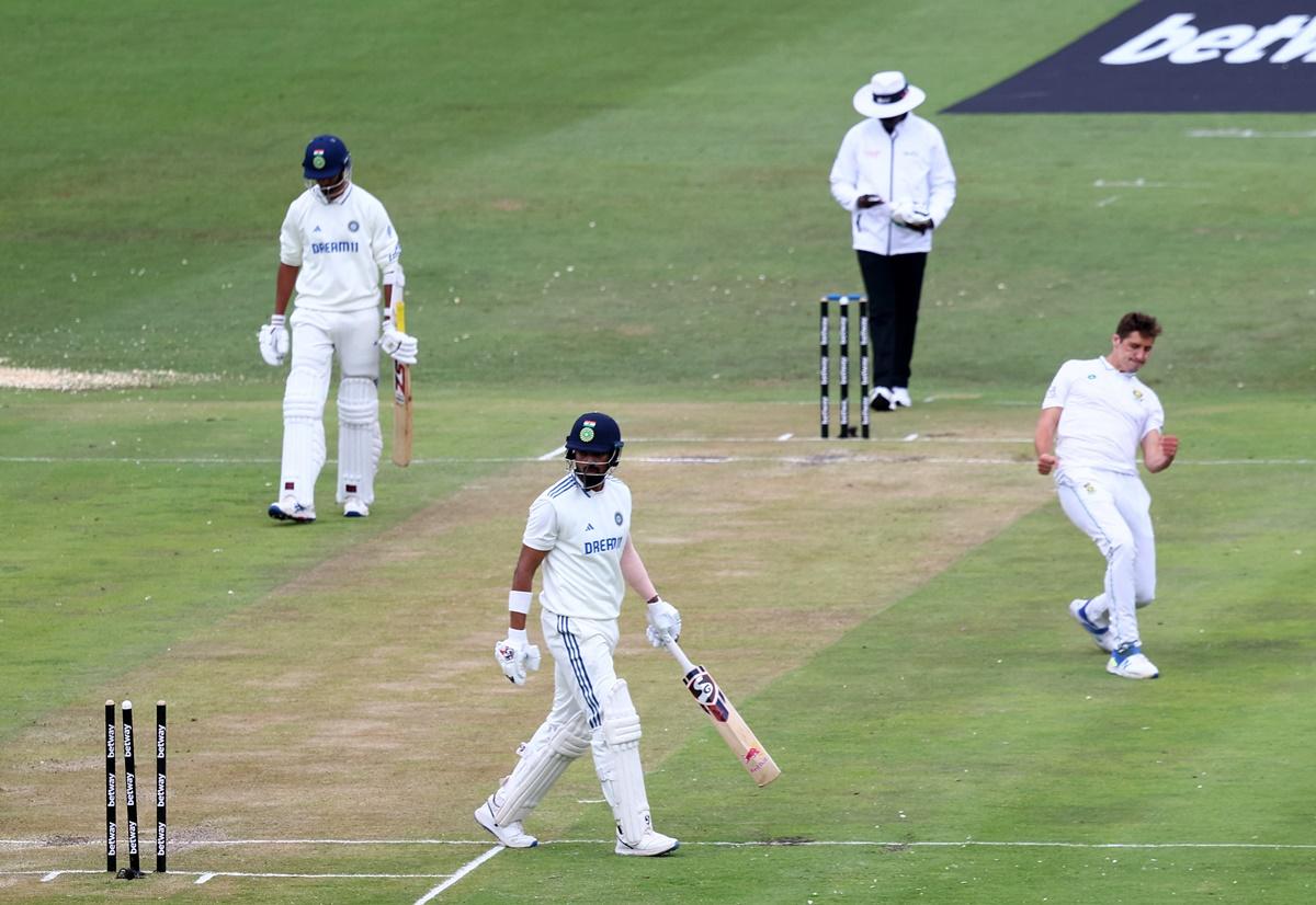 K L Rahul reacts after losing his wicket as South Africa's Nandre Burger celebrates.