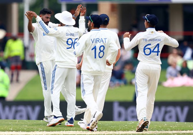 Mohammed Siraj celebrates with his India teammates after dismissing South Africa opener Aiden Markram.
