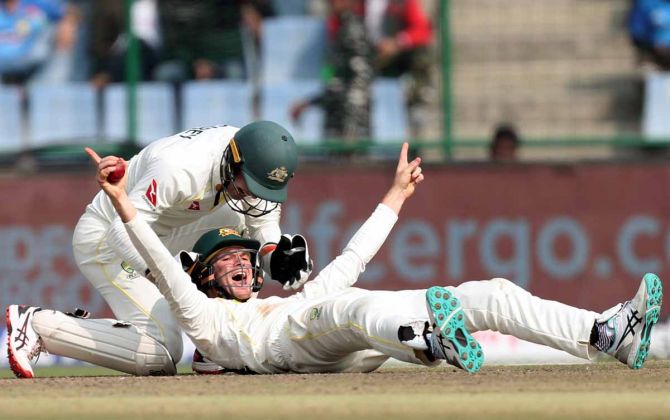 Peter Handscomb celebrates taking the catch to dismiss Shreyas Iyer off Nathan Lyon's bowling.