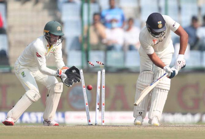 Rohit Sharma is bowled by Nathan Lyon.