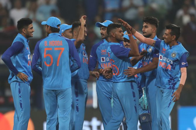 Shivam Mavi is congratulated by his India teammates after dismissing Sri Lanka opener Pathum Nissanka during the first T20 International, at the Wankhede Stadium, in Mumbai, on Tuesday.