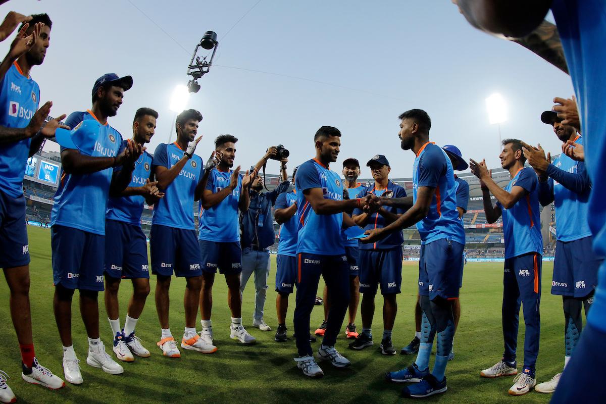 Hardik Pandya presents debutant Shivam Mavi his cap before the start of the match.