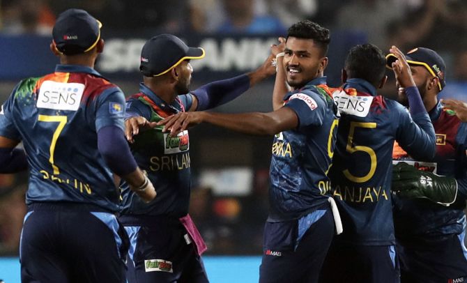 Sri Lanka's players celebrate after Dilshan Madushanka dismisses Rahul Tripathi during the second T20 International against India, in Pune, on Thursday.